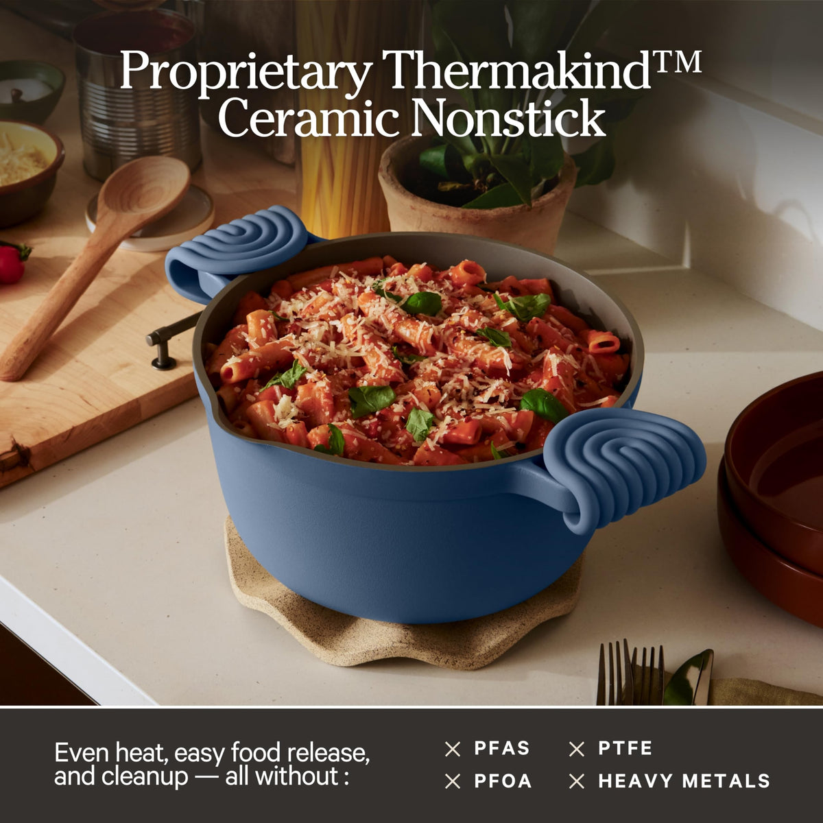 Our Place Perfect Pot on the stovetop, showcasing its ceramic nonstick surface.
