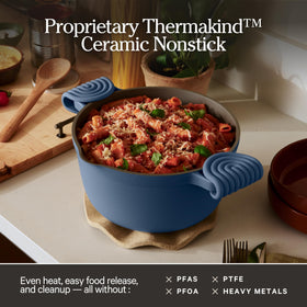 Our Place Perfect Pot on the stovetop, showcasing its ceramic nonstick surface.