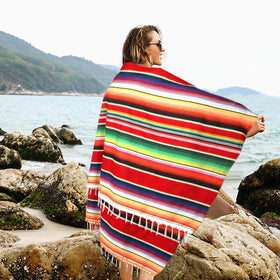OurWarm blanket used as bedspread and wall tapestry for versatile decor.
