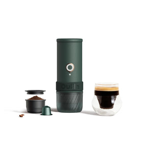 OutIn Mino portable espresso machine held in hand for on-the-go brewing.