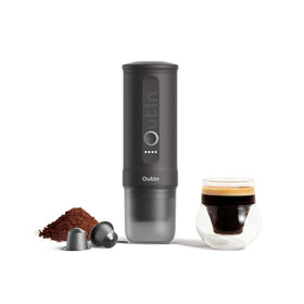 OutIn Nano espresso machine front view, compact travel coffee maker for camping.