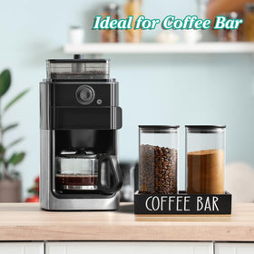 Outnili glass canister filled with ground coffee for easy scooping