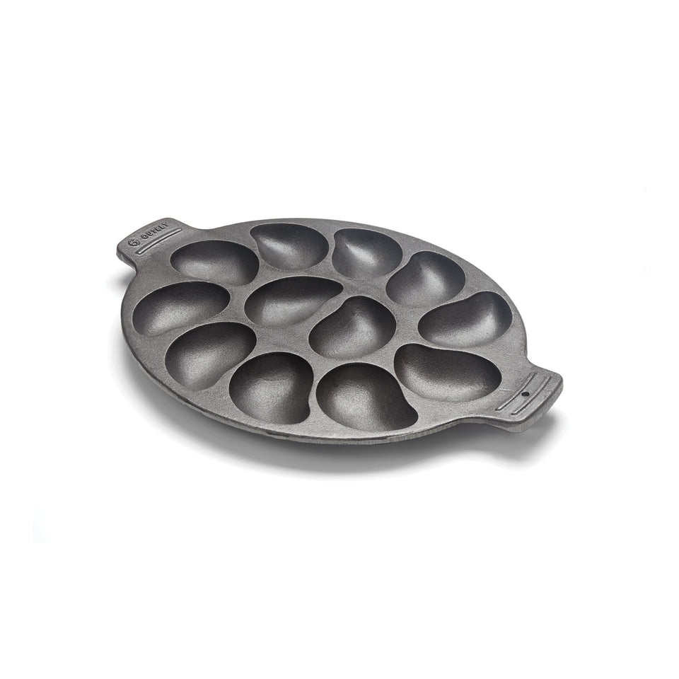 Outset cast iron oyster grill pan with 12 cavities for easy, even seafood grilling.