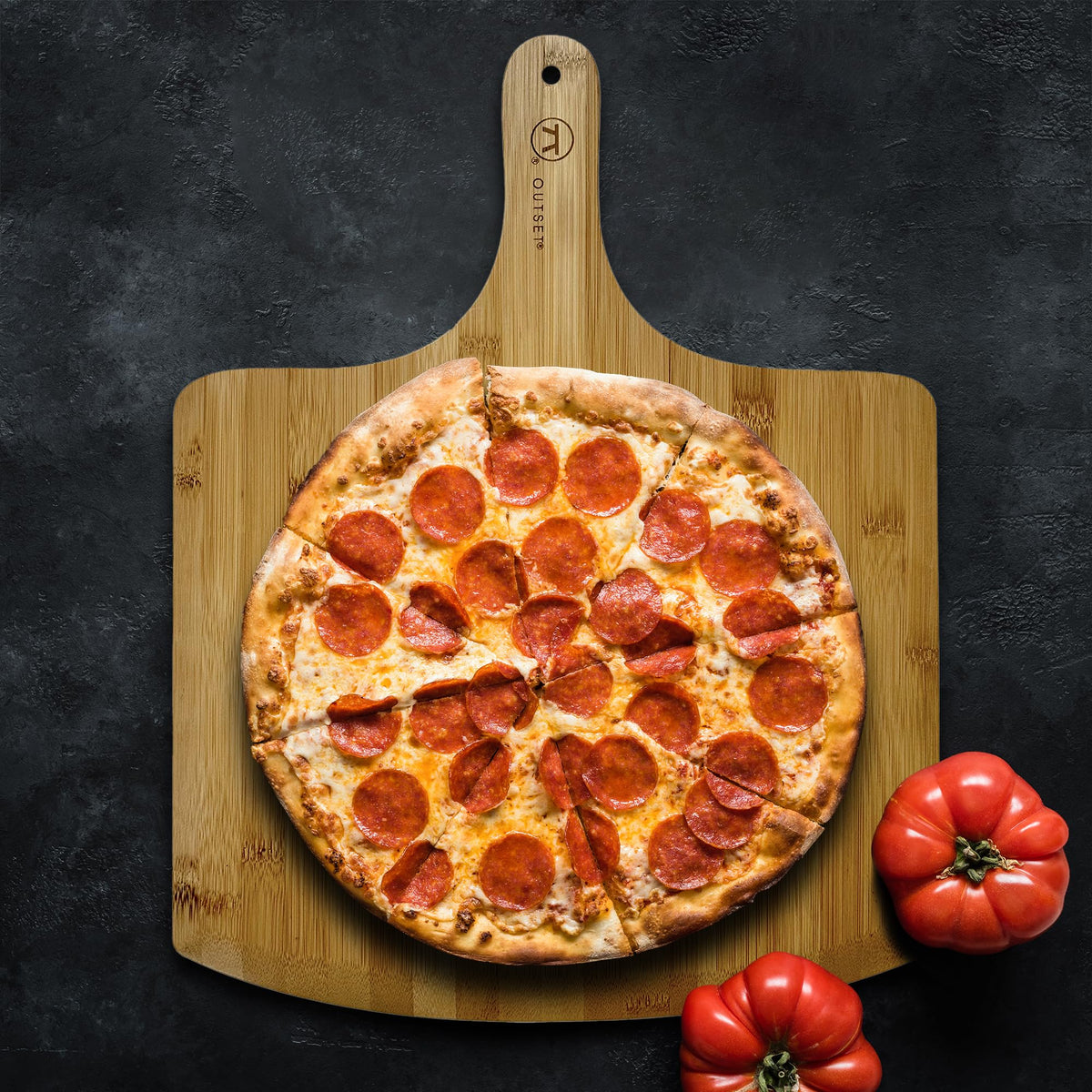 Outset pizza peel durable food-grade design for versatile serving and slicing.