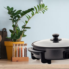 OVENTE durable lid spacer helps protect the glass lid during cooking.