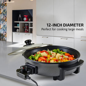 OVENTE electric skillet glass lid with steam vent for moisture retention and splatter protection.