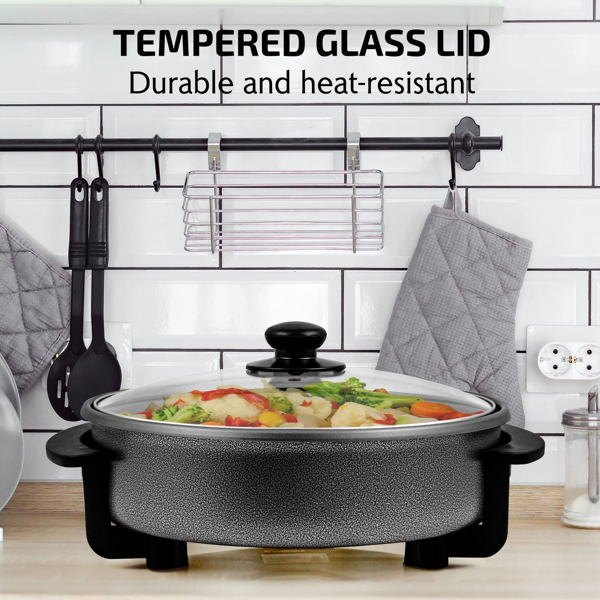 OVENTE 11.5-inch electric skillet temperature control knob enables precise cooking.