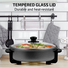 OVENTE 11.5-inch electric skillet temperature control knob enables precise cooking.