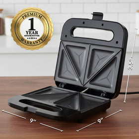 OVENTE sandwich maker close-up of golden-brown toasted sandwich with sealed edges