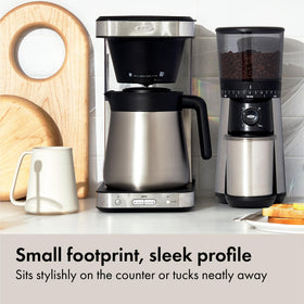 Removable well cover elevates short mugs or allows tall cups.