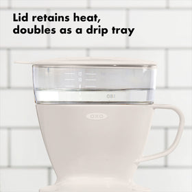 Brewing in progress with ground coffee and even water distribution