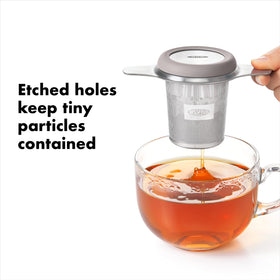 OXO Brew Tea Infuser Basket with etched holes traps tiny particles for clean tea.