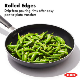 Close-up of diamond-reinforced ceramic coating on OXO pan for durable non-stick release.