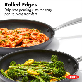 OXO Enhanced 12-inch frying pan featuring stainless steel handle for a secure grip.