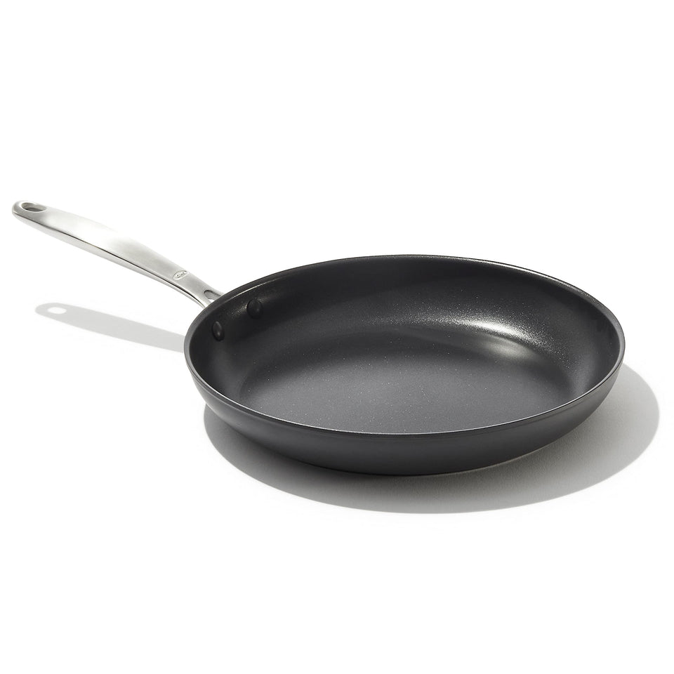 OXO Enhanced 12-inch frying pan top view shows diamond-reinforced ceramic coating for easy food release.