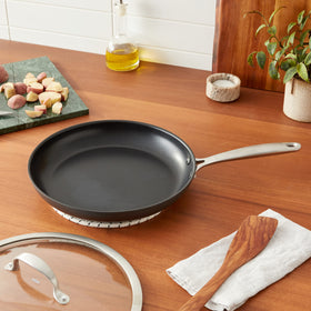 OXO Enhanced pan handle with sturdy stainless-steel grip for secure transfers.