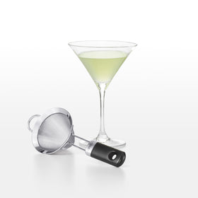 OXO fine mesh cocktail strainer in-use over glass shows pulp-free pours