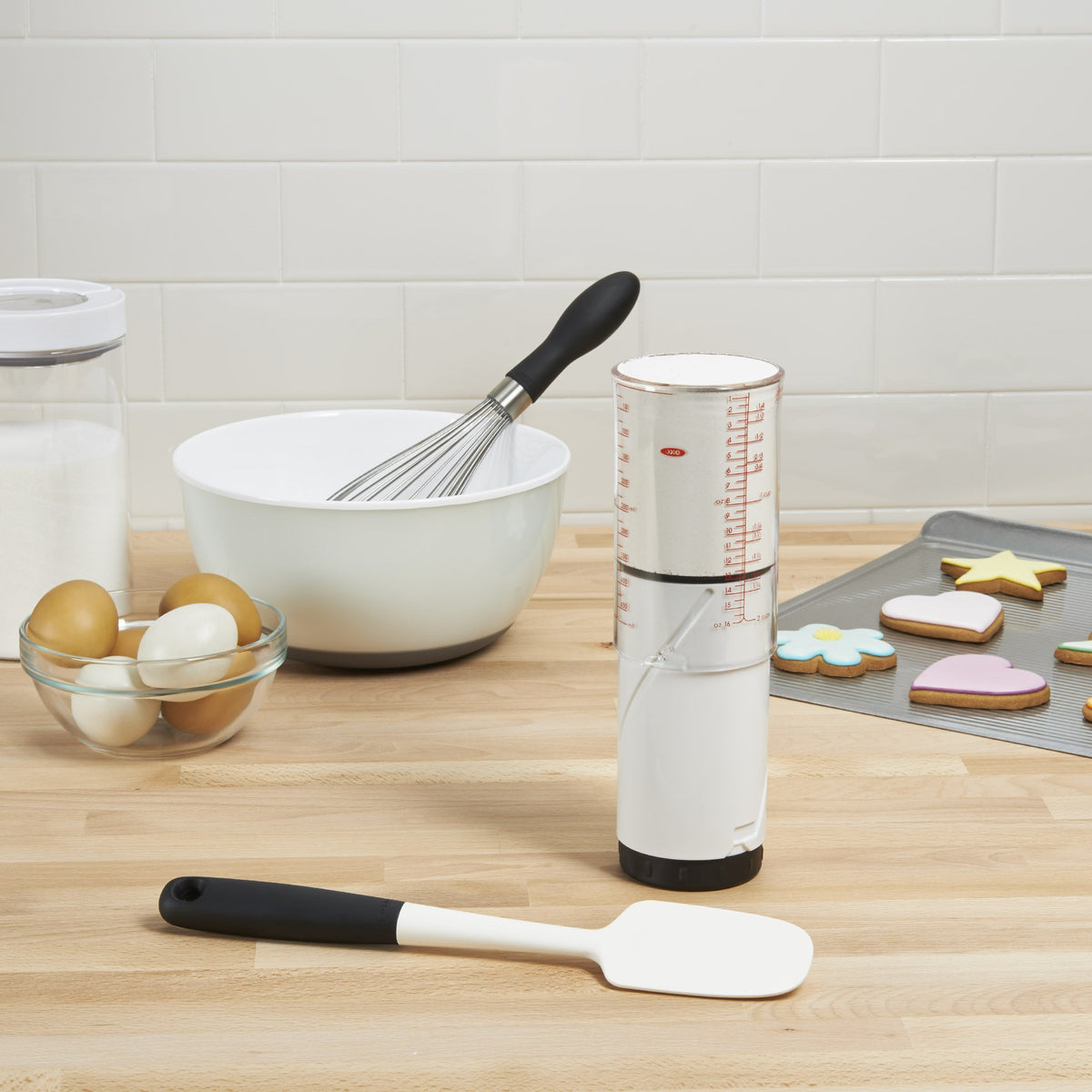 OXO Good Grips 2 Cup adjustable measuring cup in use with honey showing stickiness