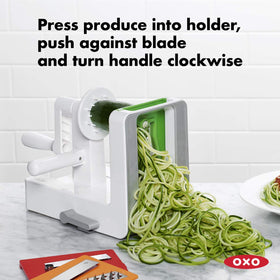 OXO Good Grips rotating handle with side grip guides produce through blades.