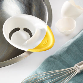 OXO Good Grips egg separator showing shell catcher base catching shells.