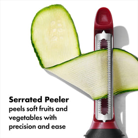 OXO Good Grips 3-Piece Peeler Set peeling yam with the straight blade.