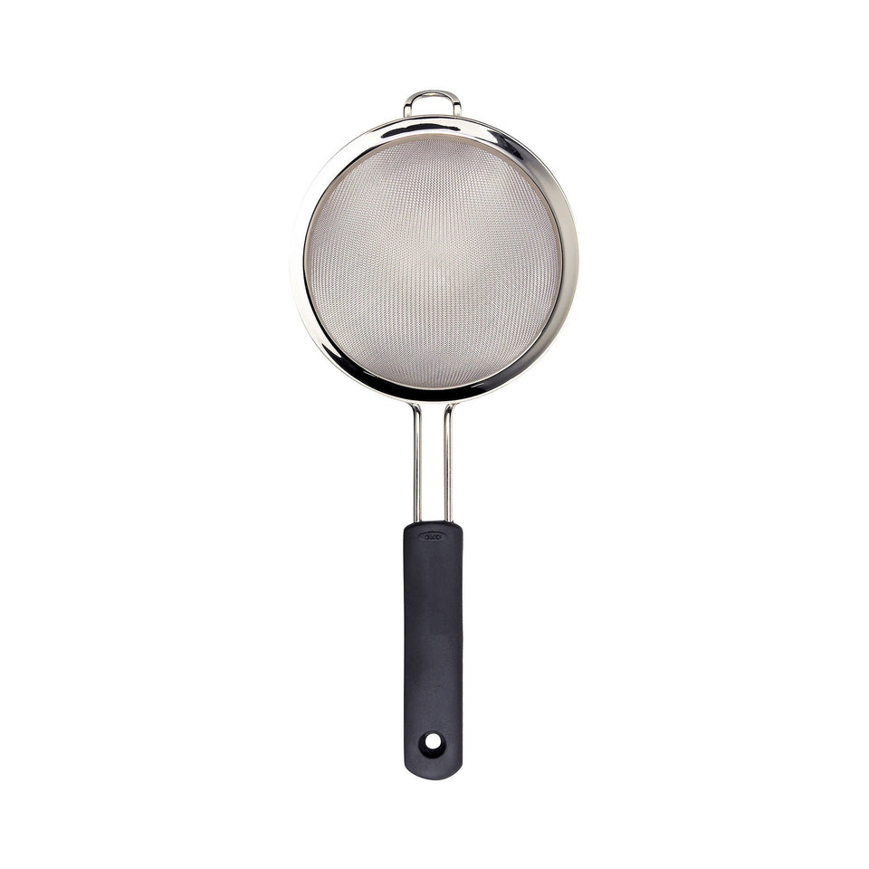 OXO Good Grips 6-in double rod strainer top view, stable on bowls for quick draining