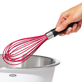 OXO Good Grips silicone whisk dishwasher-safe for easy cleanup.