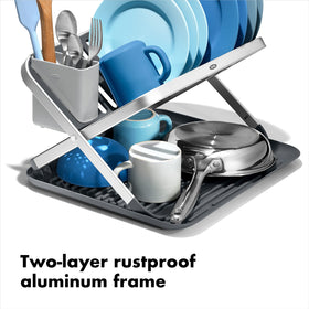 OXO Good Grips aluminum fold-flat dish rack with drainboard keeps items elevated for quick drying