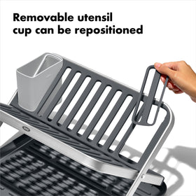 OXO Good Grips aluminum fold-flat dish rack features non-slip feet for stable counter use