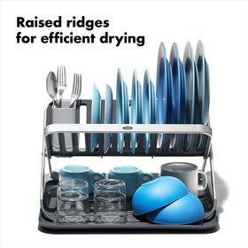 OXO Good Grips aluminum fold-flat dish rack shows removable utensil cup on the side