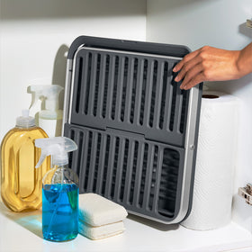 OXO Good Grips aluminum fold-flat dish rack's two-tier design accommodates varying dish sizes