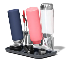 OXO Good Grips bottle drying rack holds four bottles for efficient air drying.
