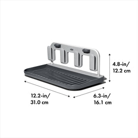OXO Good Grips drying rack has raised edges to prevent lids from rolling away.