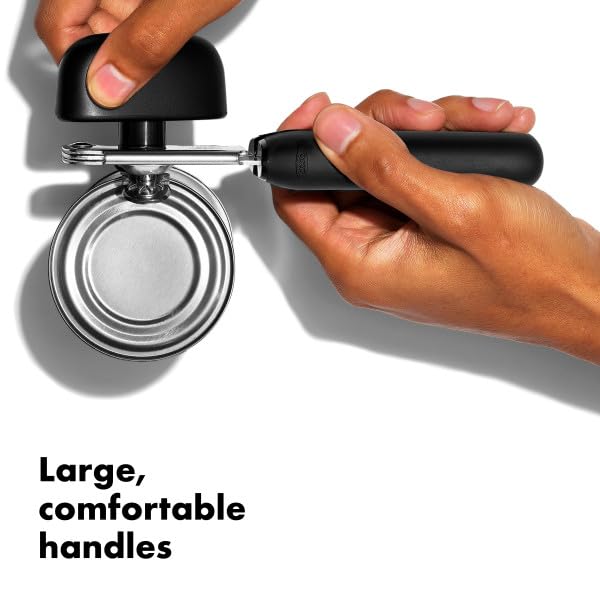 OXO Good Grips can opener with large handles demonstrates comfortable, slip-proof use.