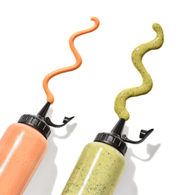 Attached cap stays open while squeezing the OXO Chef's Squeeze Bottle