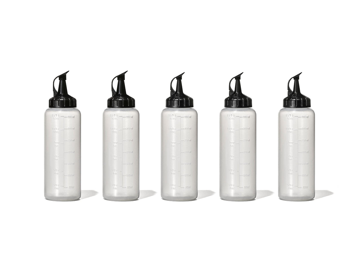 OXO Good Grips Chef's Squeeze Bottle five-pack with attached caps for easy storage.