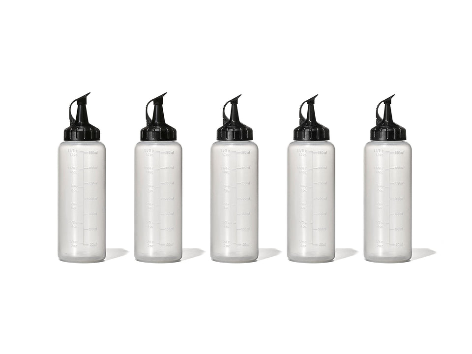 OXO Good Grips Chef's Squeeze Bottle five-pack with attached caps for easy storage.