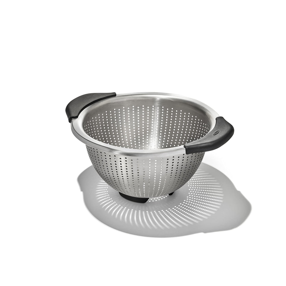 OXO Good Grips colander close-up shows elevated handles for comfortable rinsing