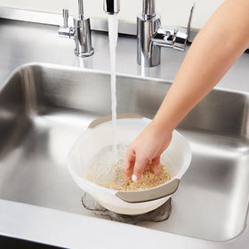 OXO Good Grips rice colander soft non-slip handles aid shaking and pouring.