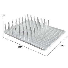 OXO Good Grips Compact Dish Rack biscuit, raised ribs prevent water pooling under dishes.