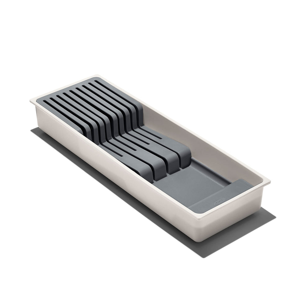 OXO Good Grips Compact Knife Drawer Organizer in a tidy drawer, saving space.