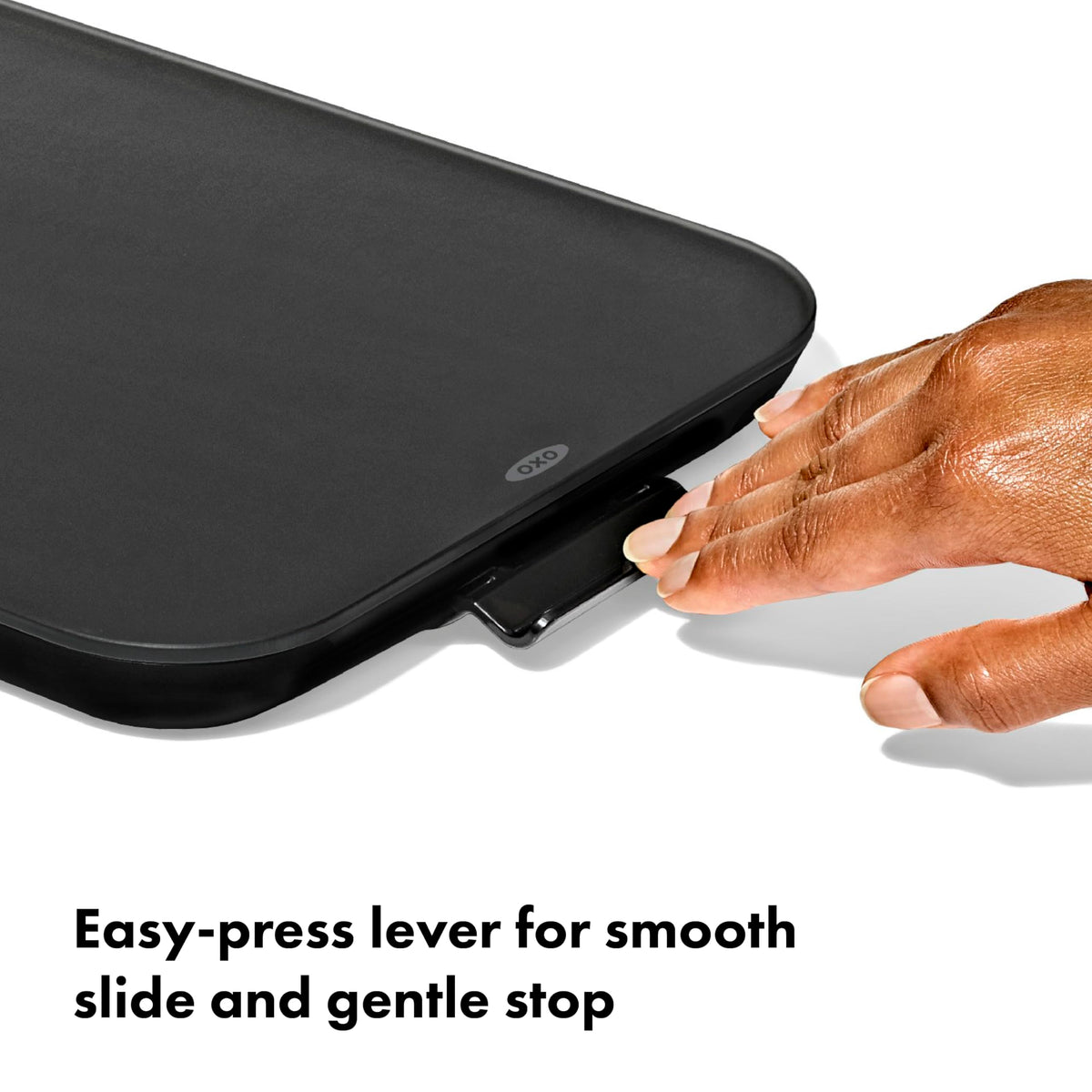 Close-up of the brake-lever on the OXO Countertop Slider enabling smooth stops