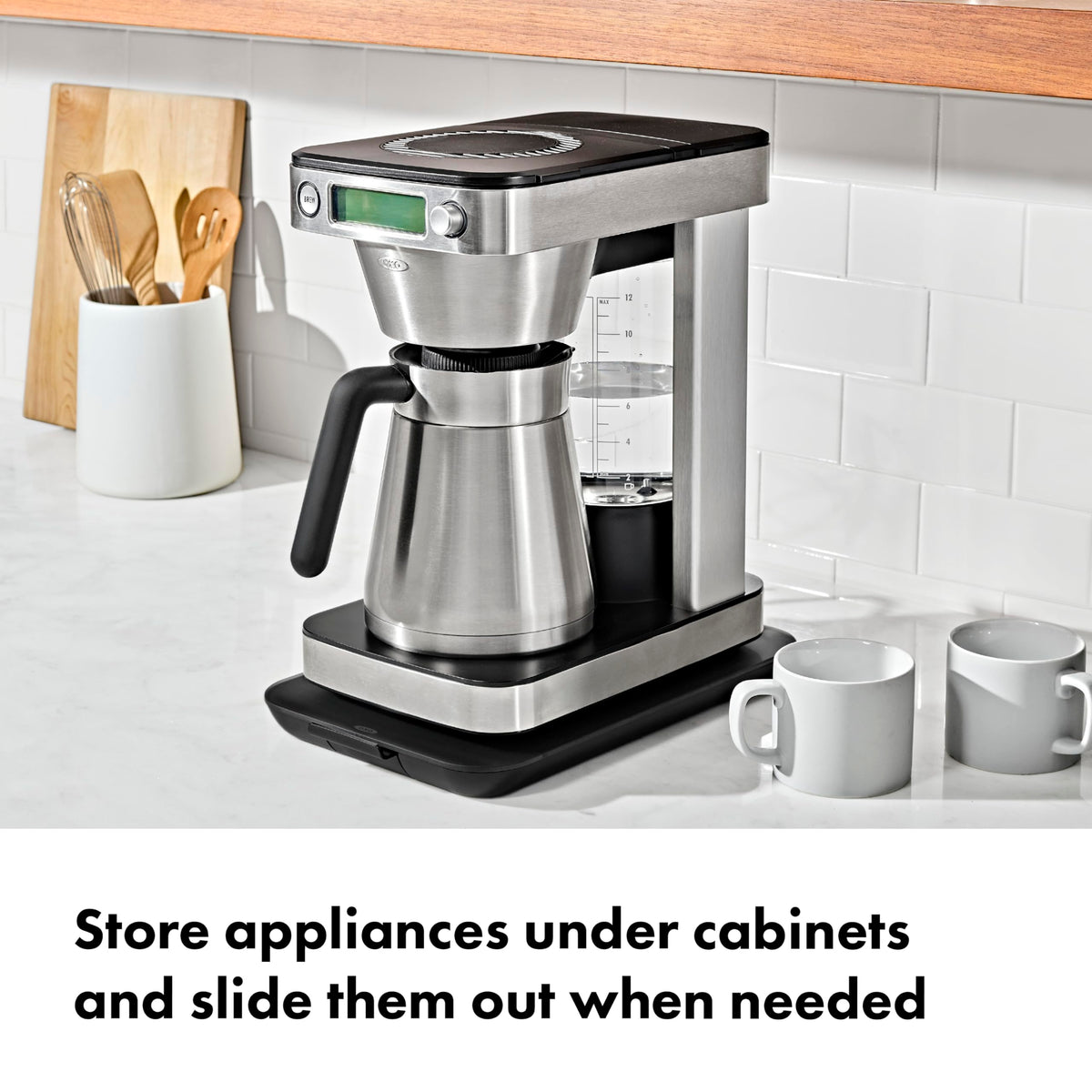 Under-cabinet storage with the OXO Countertop Slider keeps a compact kitchen organized