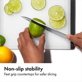 OXO Good Grips cutting board with drip-catcher keeps counters clean.