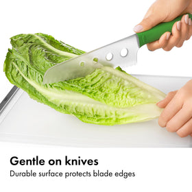 OXO Good Grips board's non-slip feet stabilize chopping for safer prep.