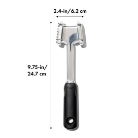 OXO Good Grips die-cast tenderizer with marbled steak ready for cooking
