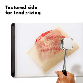 OXO Good Grips tenderizer smooth side ready to flatten meat evenly