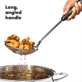 OXO Good Grips durable stainless steel skimmer supports steady kitchen work
