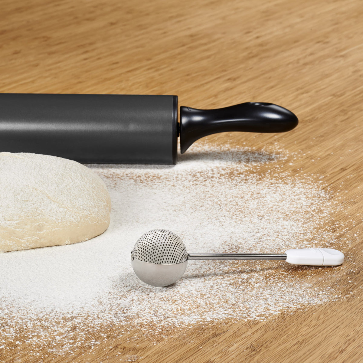 OXO Good Grips dusting wand with soft non-slip handles for comfortable use.