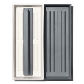 OXO Good Grips Expandable Long Tool Organizer, expanded to fit long-handled tools.